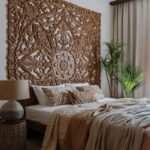 A handcrafted wooden headboard with a bohemian-inspired design
