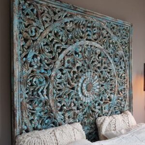 A wooden headboard in a rich blue